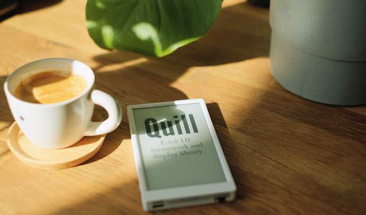 An e-ink screen hanging in front of a meeting room.